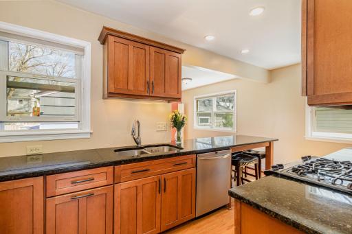 Beautifully updated kitchen cabinets, appliances, windows and countertops