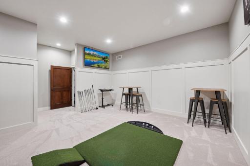 Golf Simulator with additional TV for entertainment