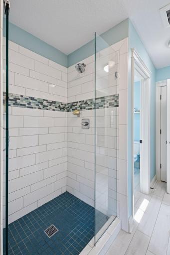 Jack-n-Jill Bathroom with linen closet and toilet