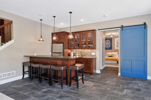 Bar area and barn door to guest bedroom and bath