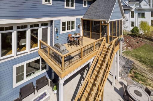 Large deck with multiple entrances into the main floor
