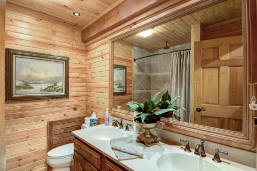 Full bath with double vanity located upstairs located upstairs