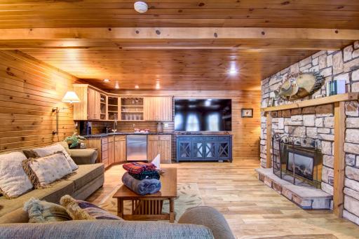 Great lower level family room / wet bar with stone gas fireplace!