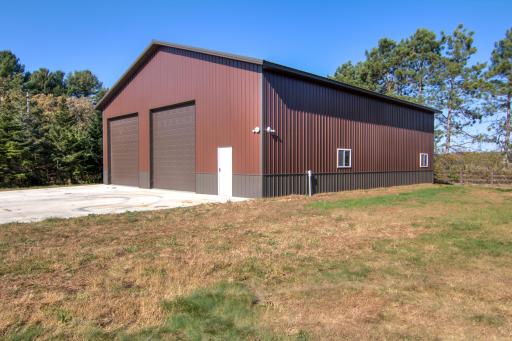 New 48' x 56' pole building w/ 14' doors added in 2022 with concrete floor and electric.