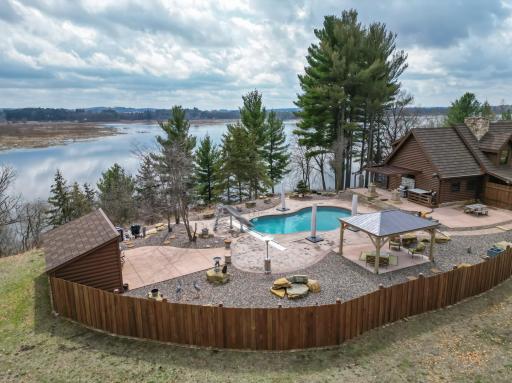 The private pool terrace is complete with a gazebo, pool house, fun water slide and great grilling patio area under the pergola!