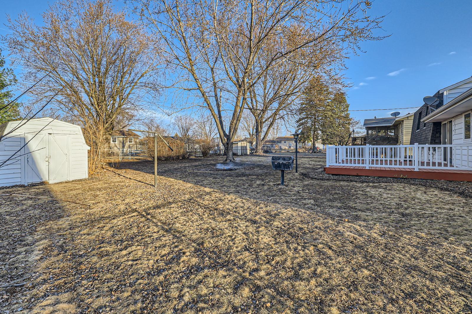 Storage shed in the fully fenced in back yard