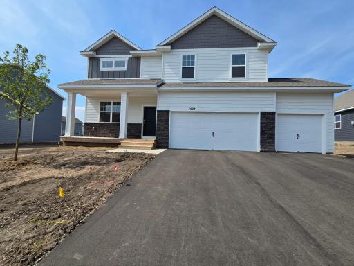 Photo of actual home at 4603 172nd St, available for quick move-in! Welcome to our Henry floorplan! With 5 BR, 3 BA, a 3-car garage, and 2622 total finished sq ft plus an unfinished basement.