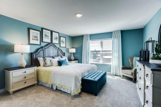 Retreat to your oversized primary suite, with abundant windows that bring in plenty of natural light and overlook your backyard.