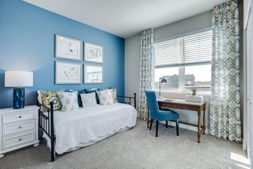 Tucked back off the mudroom, and away from the hustle and bustle of the main level living spaces, this bedroom resides adjacent to a 3/4 bath and serves as the perfect guest room or your home office!