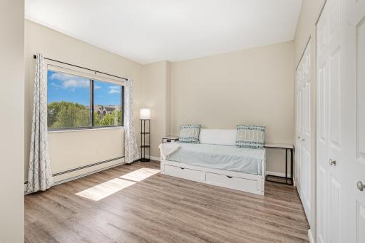 View of the 2nd bedroom with full walll closet and private entrance onto the porch