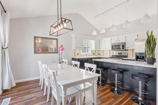 The informal dining room offers a bright and welcoming space. Its open layout seamlessly connects to the kitchen and living areas, making mealtime both convenient and enjoyable.