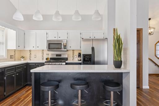 The kitchen is a perfect blend of style and functionality, featuring ample cabinetry, sleek countertops, and modern appliances.