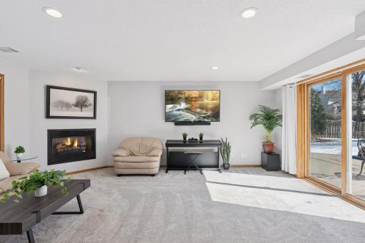 The family room with a cozy gas fireplace, creating a warm and inviting atmosphere.