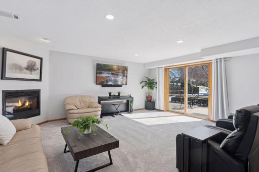 The family room's open layout is perfect for relaxing or entertaining, with seamless access to the outdoors.