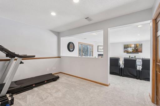 The bonus room is a versatile space, perfect for a home gym, yoga studio, or hobby area. With ample room and natural light, it provides a comfortable setting for workouts or relaxation.