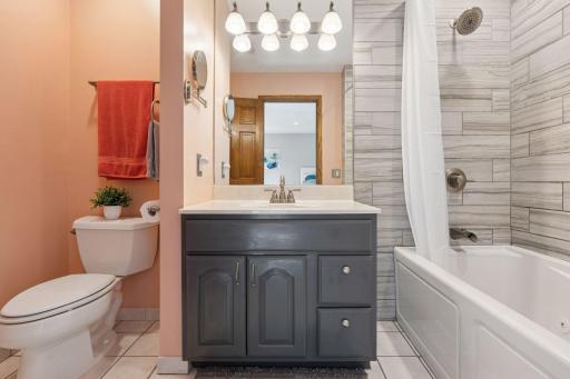 The primary suite bathroom is designed for comfort and convenience.