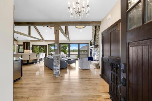 The main floor is spacious, bright and open with hickory hardwood floors, a gas fireplace in the living room, vaulted ceilings and a wall of windows facing east which provide expansive views of Lake Johanna.