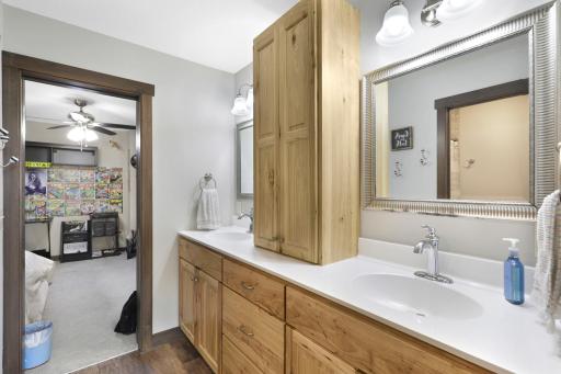 The 2 kidsâ rooms on the lower level are served by a jack and jill bathroom with dual vanities and a separate shower/toilet room.