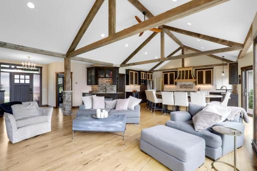The main floor is spacious, bright and open with hickory hardwood floors, a gas fireplace in the living room, vaulted ceilings and a wall of windows facing east which provide expansive views of Lake Johanna