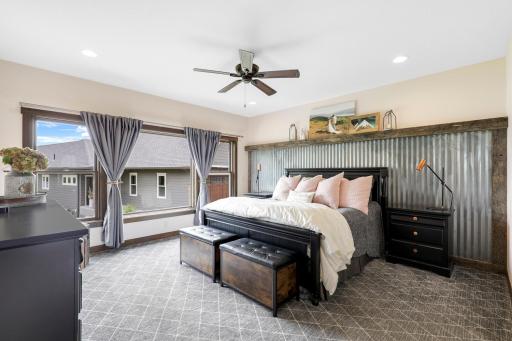 The primary ensuite is generously sized with a walk-in shower, dual vanities and a massive walk-in closet.
