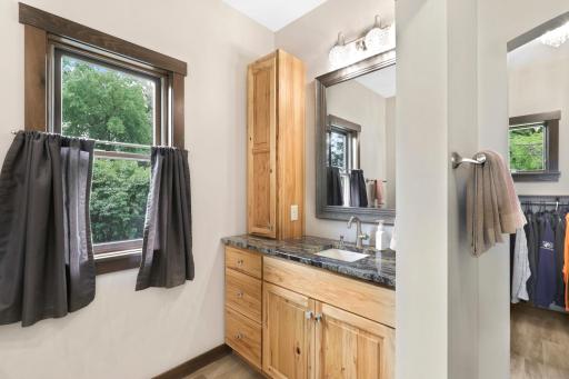 The primary ensuite is generously sized with a walk-in shower, dual vanities and a massive walk-in closet.