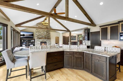 The chefâs kitchen, open to the dining and living rooms, features a Viking double oven with 6-burners + a griddle, custom fanhood which vents to the exterior, an oversized refrigerator, new dishwasher, pantry, a huge granite topped island & wet bar.