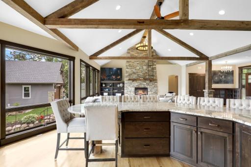 The chefâs kitchen, open to the dining and living rooms, features a Viking double oven with 6-burners + a griddle, custom fanhood which vents to the exterior, an oversized refrigerator, new dishwasher, pantry, a huge granite topped island & wet bar.