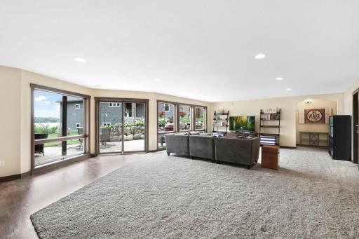 The intelligently designed lower level walks out to a massive paver patio and features a spacious family room with a wet bar, an easily accessible bathroom to serve the indoor and outdoor common areas, a huge storage room and a utility room.