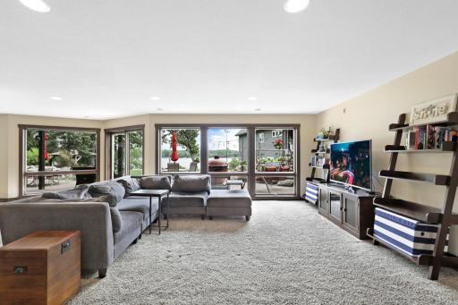 The intelligently designed lower level walks out to a massive paver patio and features a spacious family room with a wet bar, an easily accessible bathroom to serve the indoor and outdoor common areas, a huge storage room and a utility room.