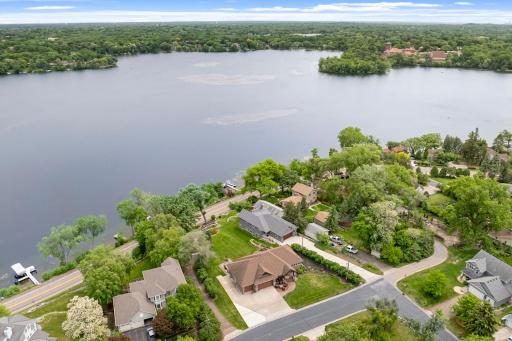 The 2/3 of an acre, pristinely landscaped and mostly flat lot features 87 feet of waterfront on Lake Johanna.