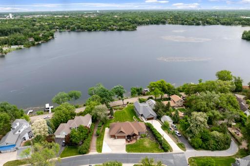 The 2/3 of an acre, pristinely landscaped and mostly flat lot features 87 feet of waterfront on Lake Johanna.
