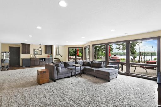 The intelligently designed lower level walks out to a massive paver patio and features a spacious family room with a wet bar, an easily accessible bathroom to serve the indoor and outdoor common areas, a huge storage room and a utility room.