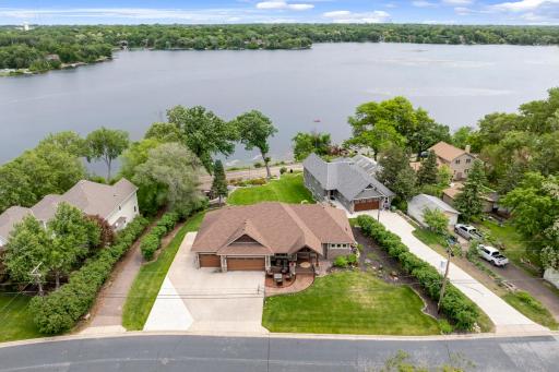 The 2/3 of an acre, pristinely landscaped and mostly flat lot features 87 feet of waterfront on Lake Johanna.