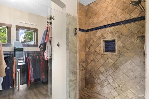 The primary ensuite is generously sized with a walk-in shower, dual vanities and a massive walk-in closet.