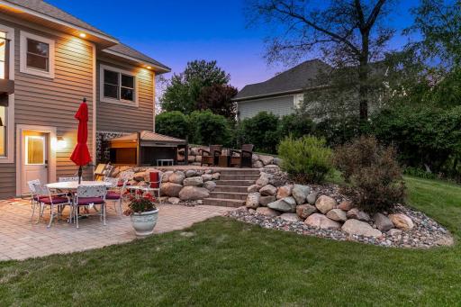 The current owners invested significant capital to optimize the useability of the outdoor space including enlargement of the primary driveway, improving the area leading to front entry, adding a garden, boulder retaining walls, a hot tub & gazebo.