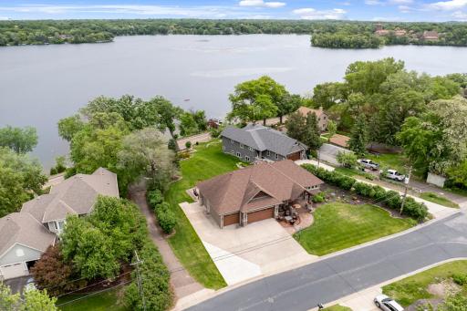 The 2/3 of an acre, pristinely landscaped and mostly flat lot features 87 feet of waterfront on Lake Johanna.