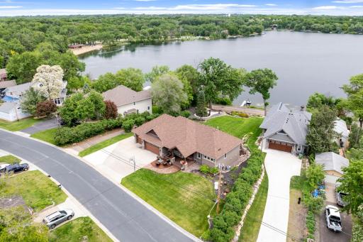 The long supplemental driveway on the north side of the property provides plenty of extra parking/storage and it is hidden from the rest of the property by a row of lilac bushes.
