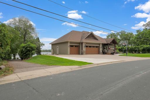 The long supplemental driveway on the north side of the property provides plenty of extra parking/storage and it is hidden from the rest of the property by a row of lilac bushes.