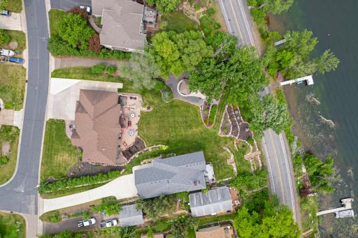 The long supplemental driveway on the north side of the property provides plenty of extra parking/storage and it is hidden from the rest of the property by a row of lilac bushes.
