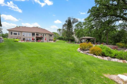 The 2/3 of an acre, pristinely landscaped and mostly flat lot features 87 feet of waterfront on Lake Johanna.