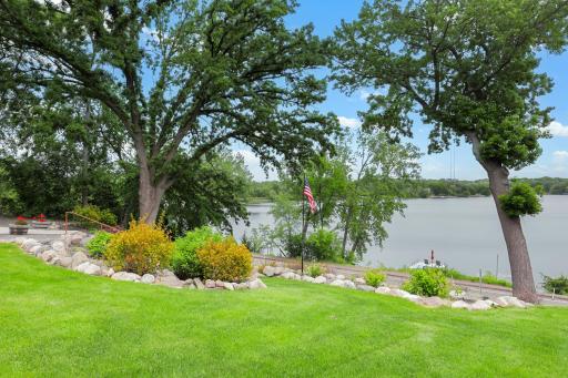 The extensive landscape project includes a golfcart path for easy access to the lake.