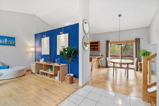 Welcomed by vaulted ceilings and beautiful refinished hardwood floors.