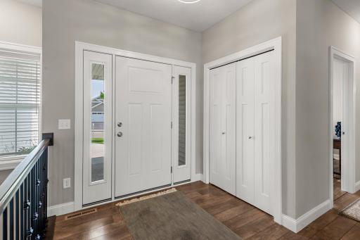 This home features rustic laminate flooring and sleek white trim.