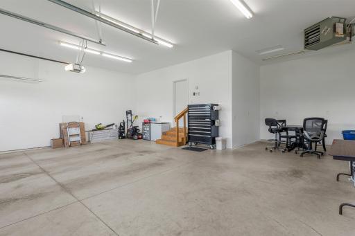 The garage is heated and insulated, and includes an extended third stall.