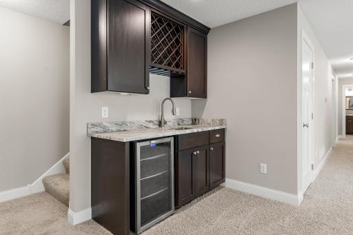 The wet bar is the perfect compliment to the large family room.