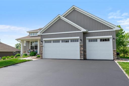 This home features a covered front porch and beautiful touches such as the brick accents on the front of the home.
