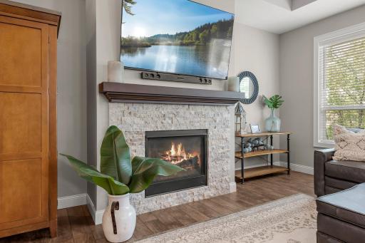 The stone fireplace is the perfect centerpiece for the living room.
