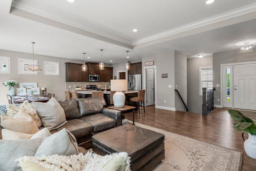 This home features rustic laminate flooring and sleek white trim.