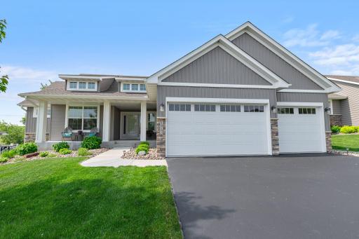 This home features a covered front porch and beautiful touches such as the brick accents on the front of the home.