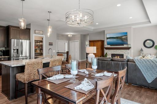The main level features an open floor plan and a tray ceiling in the living room.